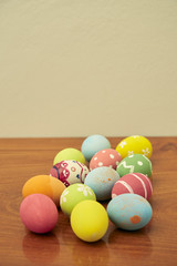 happy easter eggs on wooden