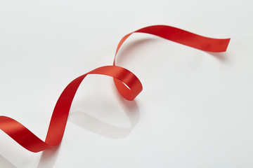 Red curly ribbon isolated on white