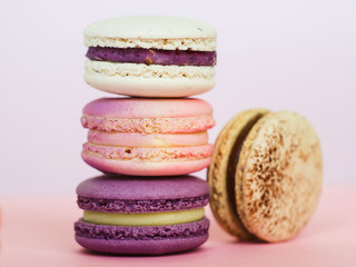 Pyramid of bright colored macaroni cakes. Sweet dessert, delicious French cookie. Copy space for the inscription.