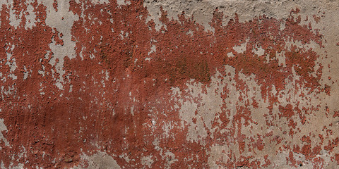 red wall background with withered paint. Old plaster texture