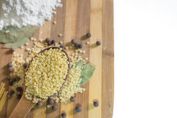 Wooden spoon full of tiny pasta in star shape