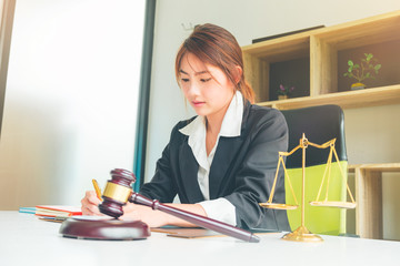 Beautiful asian woman lawyer working and gavel in front, Advice and Legal services Concept.
