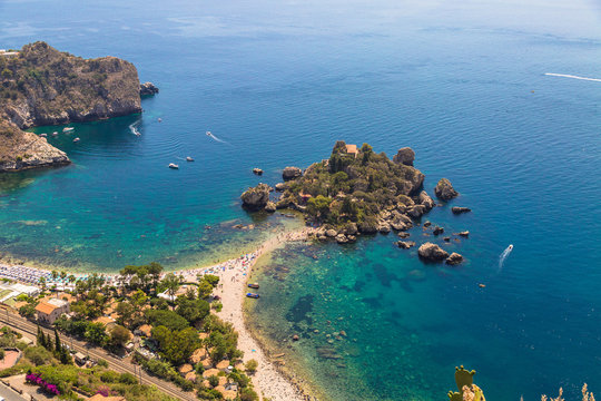 Aerial view of island and Isola Bella beach and blue ocean water in Taormina, Sicily, Italy