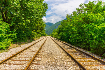 Fototapeta premium An old railway track near Asopos old railway station at national park of Oiti in Central Greece