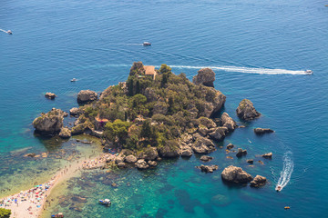 Aerial view of island and Isola Bella beach and blue ocean water in Taormina, Sicily, Italy