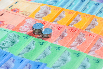Malaysian ringgit banknotes and coins background. Financial concept.