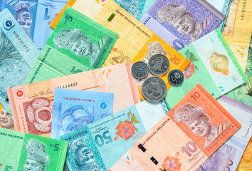 Malaysian ringgit banknotes and coins background. Financial concept.
