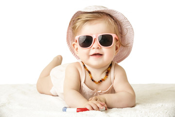 
Studio portrait of adorable baby girl wearing pink plastic sunglasses, isolated on the white...