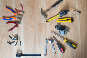 repairs or construction tools on wooden background