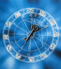 key to success astrology and success concept with gold key, horoscope with zodiac signs over blue background 