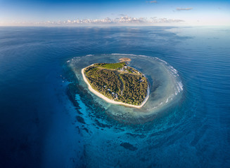 Lady Elliot Island and its coral reef viewed from the sky at sunset