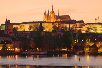 Obraz premium St. Vitus Cathedral in the night illumination against the background of the April sunset. Czech Republic, Prague