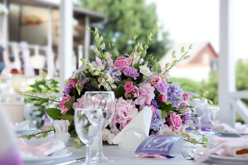 Serving wedding table with flowers