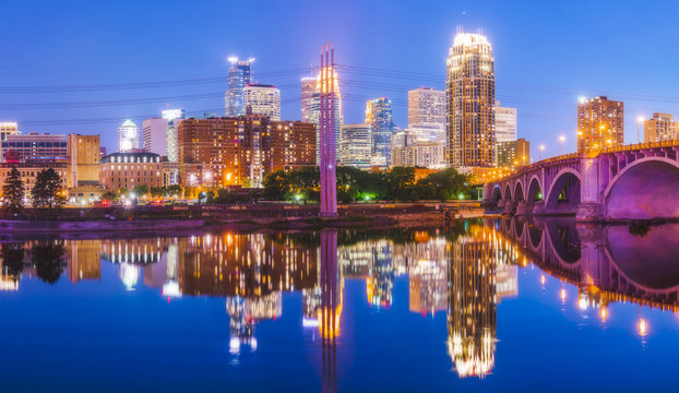  Minneapolis skyline with reflection in river at night.