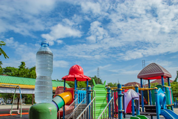 Fototapeta na wymiar Drink water and bright blue sky In the playground.