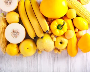 Zelfklevend Fotobehang Yellow color assorted vegetables and fruits © manyakotic