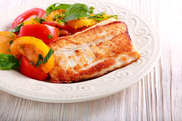 Fried white fish and tomato salad