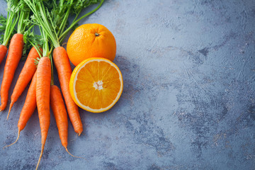 young carrots and orange