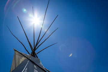 Aboriginal teepee illuminated by the sun