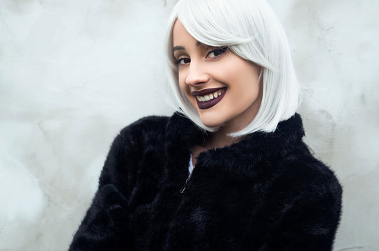 Young Smiling Woman In Fur Jacket