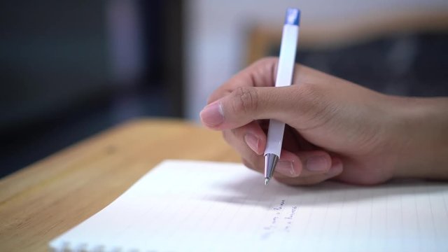 Asian Student note on notebook while learning study and writing for planning work. Studying in Education at university concept. Back to school
