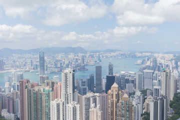 Fototapeta na wymiar Highrise modern buildings with blue sky in the city at Victoria's Peak, Hong Kong