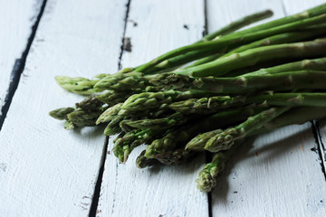 Asparagus on a white wooden background