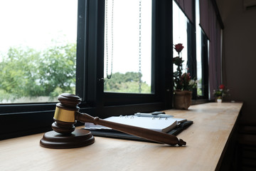 legal law gavel & notebook on wood table. lawyer attorney justice workplace