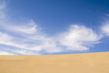 Fototapeta na wymiar Landscape photo of desert and blue sky with cloud in China