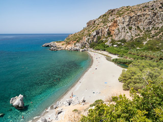 Beautiful Preveli Beach in Crete island. There is a palm forest and a river inside the gorge near this beach. Greece, june, 2018