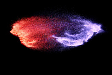 Abstract Multicolored sand explosion isolated on black background. Abstract sand cloud. Sandy fly...