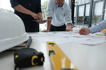 architect working on real estate project with partner at workplace. engineer discussing on living...