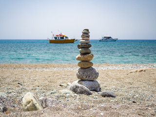 Fototapeta na wymiar Beautiful concept of balance and harmony. rocks on the coast of the Sea in the nature, Crete, Greece. June, 2018