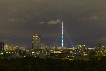 Night view of Moscow. Illumination, fireworks and podstvetka buildings. Ostankino tower.