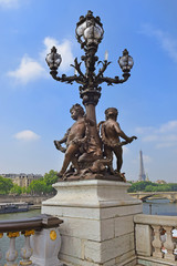 Fototapeta na wymiar Pont Alexandre III bridge and Eiffel Tower in the distance, Paris