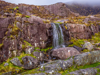 The Connor Pass Waterfall - popular landmark on Dingle Peninsula Ireland