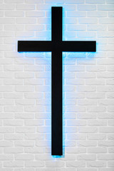 Holy Cross on Side of Brick white Wall