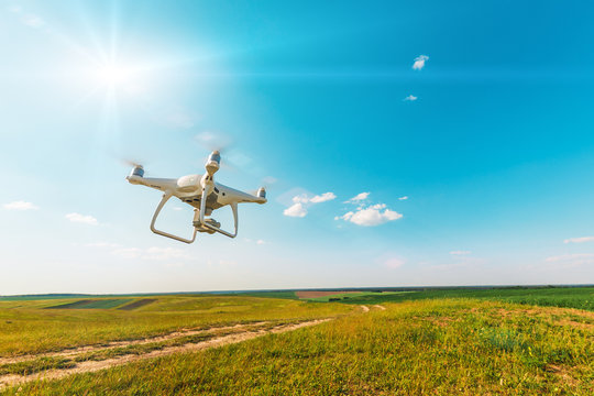 drone quad copter on green corn field