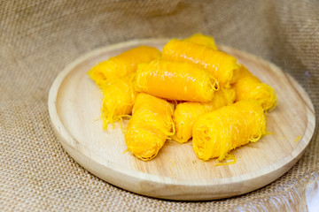 Thai dessert rolled egg yolk thread