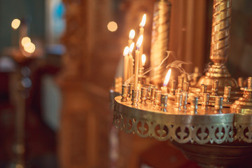 Chandelier with candles in the Church. Background for photobooks about baptism.