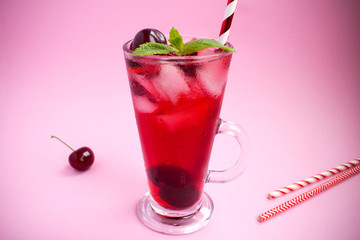 Cold cherry lemonade  on the pink  background
