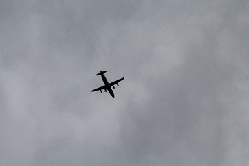 the plane on a background cloudy sky