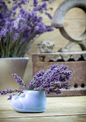 Beautiful dry lavender and old rustic rustic iron on rustic table closeup