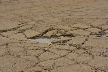 Badly damaged concrete street.