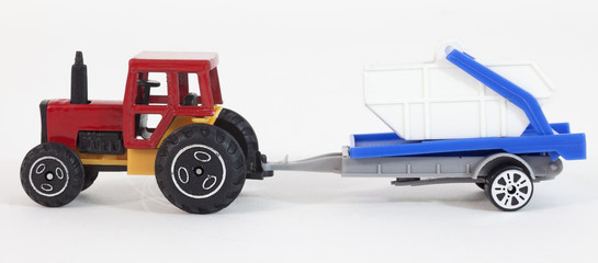 Model toy farm tractor with trailer.