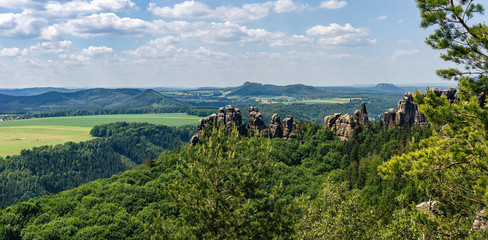 Fototapeta na wymiar Saxon Switzerland in Germany, as seen from Breite Kluft vantage Point. The Elbe Sandstone Mountains are a famous hiking region in Germany.
