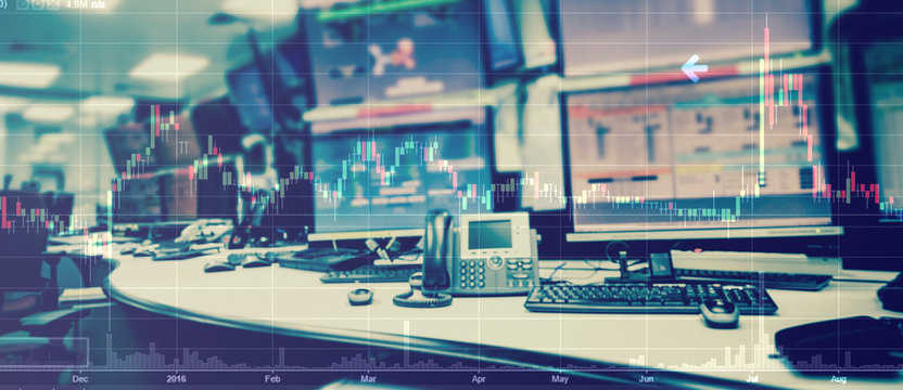 Double exposure of business stock trading room with computer and graph for Business Trading concept