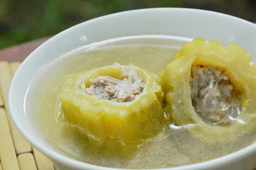 boiled bitter melon stuffed minced pork and glass noodles soup on bowl