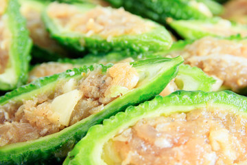 Close up bitter gourd pile with stuffed hack pork and garlic black pepper ingredient. vegetable herb Nourish the health body. Thai food