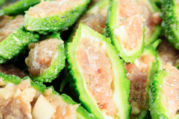 Close up bitter gourd pile with stuffed hack pork and garlic black pepper ingredient. vegetable herb Nourish the health body. Thai food